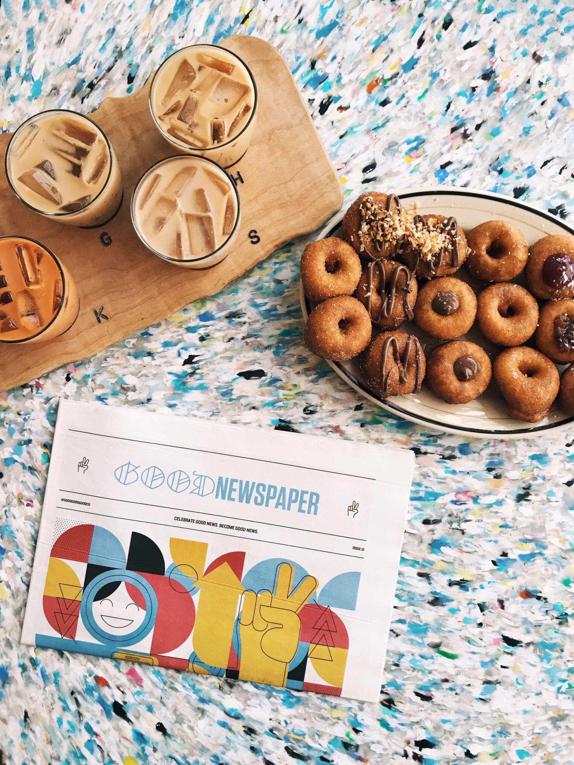 Picture of doughnuts and coffee on a colorful counter from Dough Bakery in Bed-Stuy, Brooklyn near the Refuge at 1 Halsey