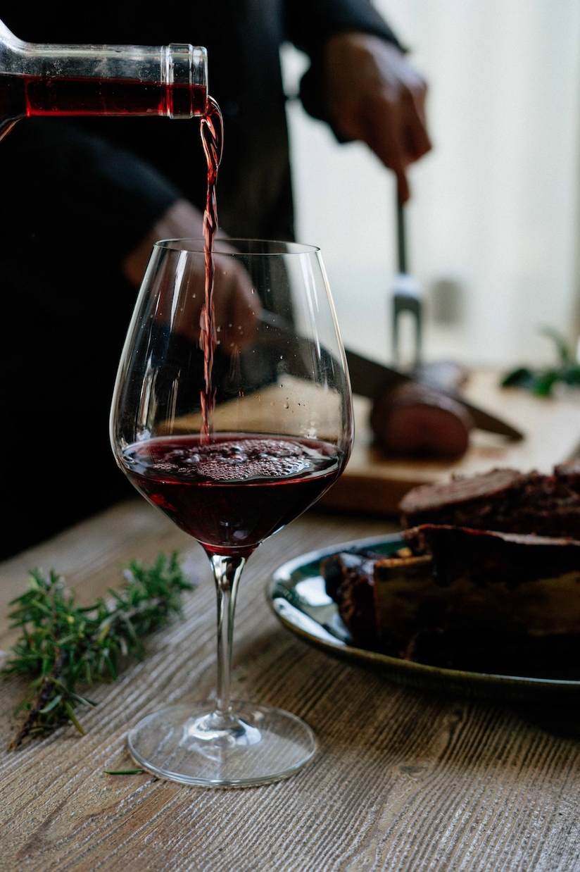 Glass of red wine being poured at Speakvino in Bedford-Stuyvesant near the Refuge at 1 Halsey